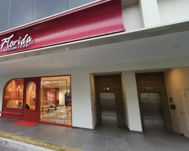 Florida Western Food restaurant storefront with red signboard and glass entrance